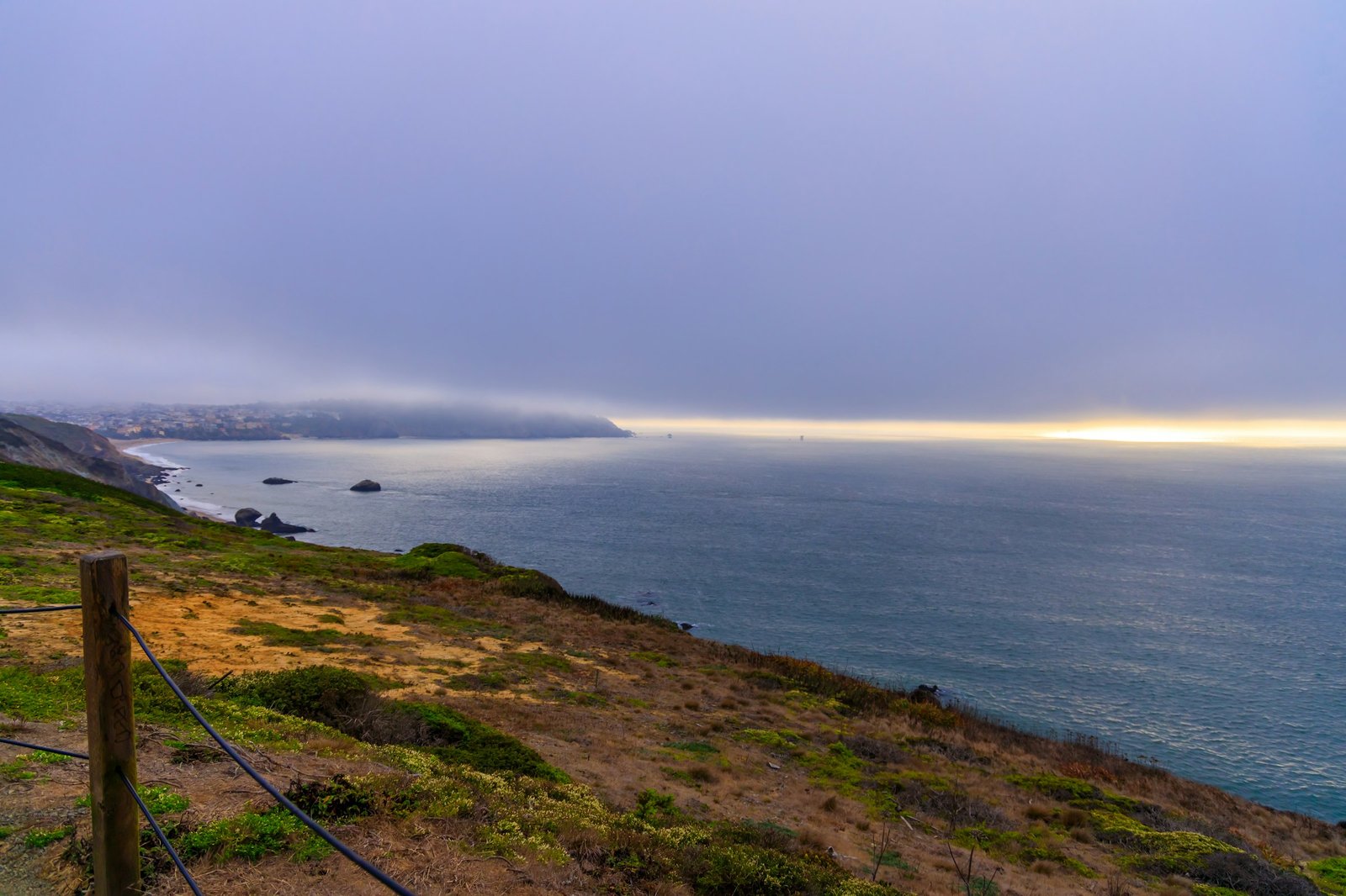 Misty coastline at dawn